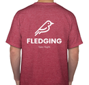 Back of red Fledging T-shirt with big bird logo, FLEDGING logo underneath, subtitle of Take Flight underneath